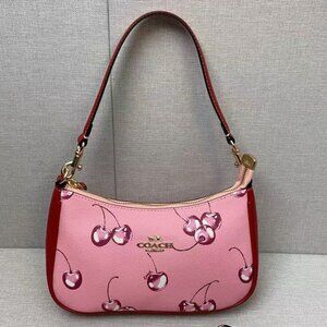 Coach red cherry print bag, size 24 x 157 cm.